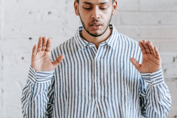 A person's hands in a calm, resting position.